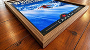 Whistler Blackcomb wall art framed travel poster displayed in a ski chalet interior
